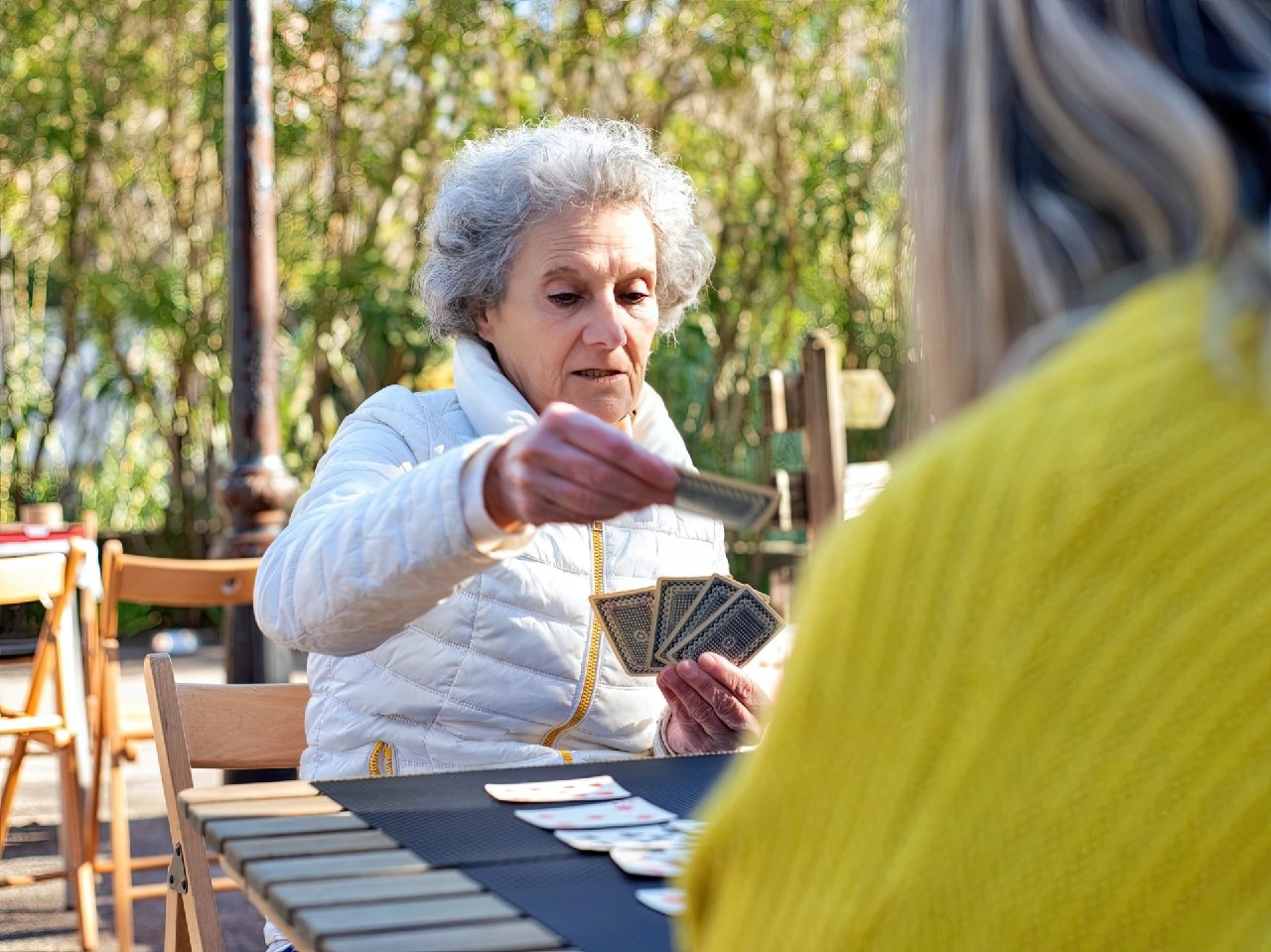 Two bridge players contemplating their next move.